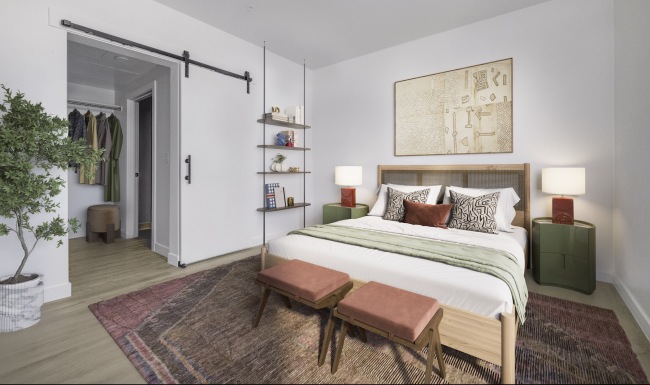 Beautiful bedrooms to fit every need a bedroom with a bed and a barn door