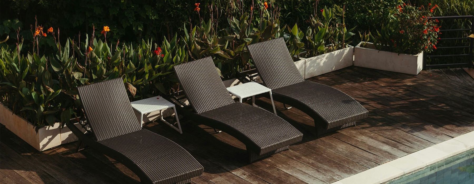 Relax and unwind poolside a group of chairs around a pool