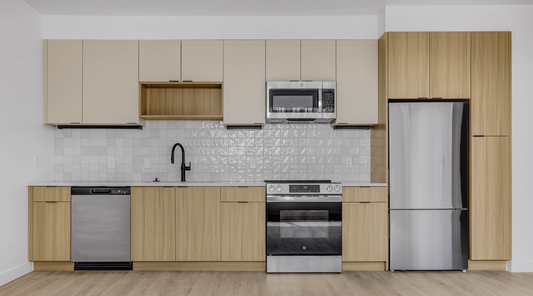 Spacious kitchens with thoughtful details a kitchen with wooden cabinets