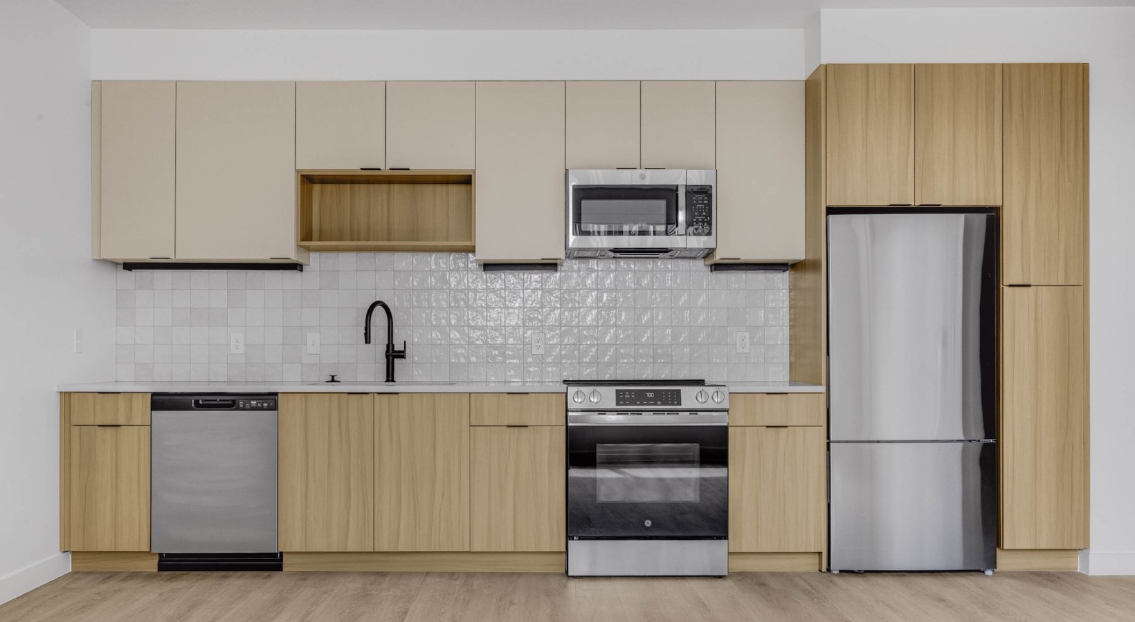 Spacious kitchens with thoughtful details a kitchen with wooden cabinets