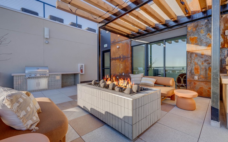 Rooftop deck with fire pit and grill at Journeyman in Salt Lake City.