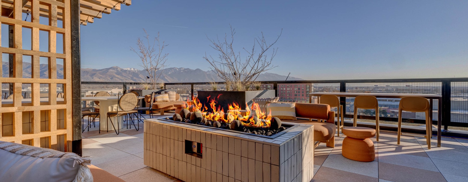 Outdoor firepit and grilling station at Journeyman apartments in Salt Lake City.	