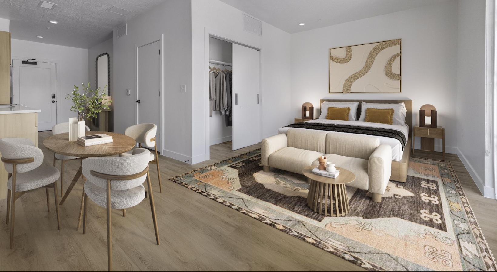 Sleep in style a studio bedroom with a bed and a dining area