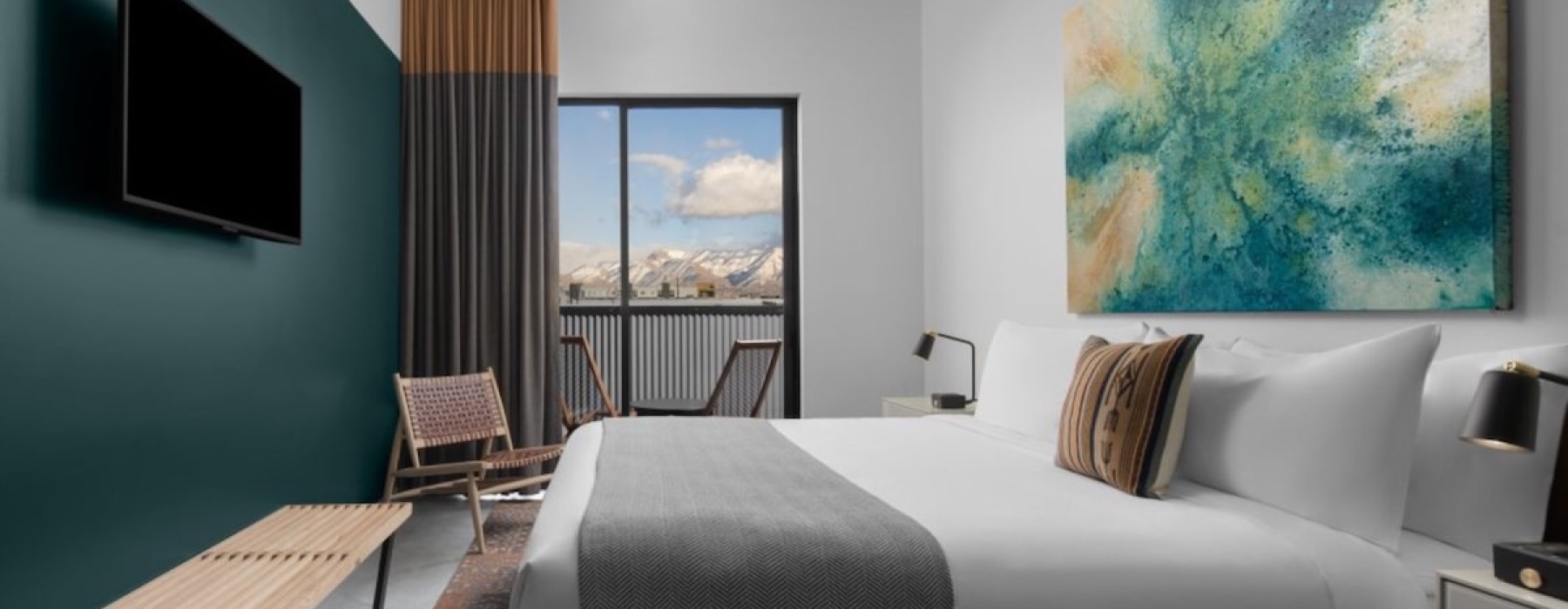 a bedroom with a bed and a tv